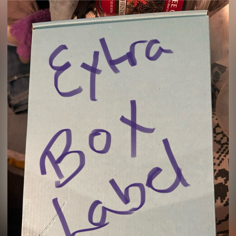 Light Blue Box with Purple Writing